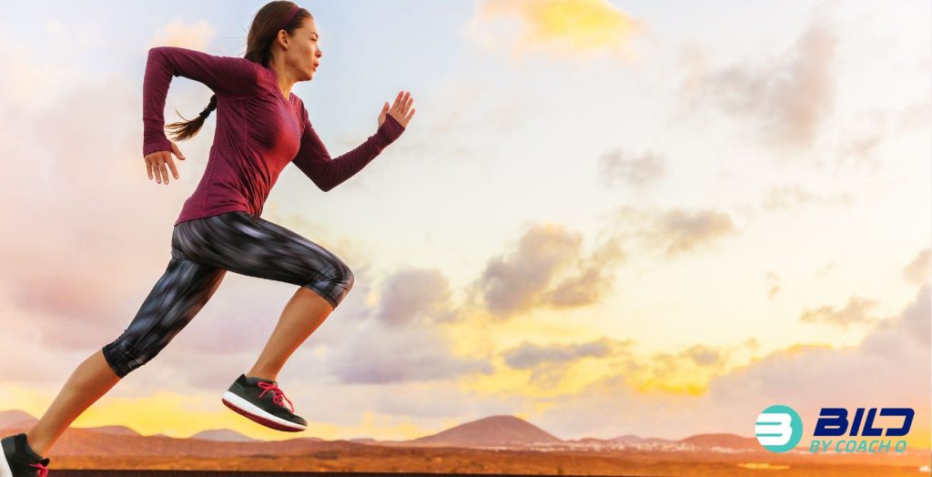 Woman running outdoors representing cardio exercise compared to strength training