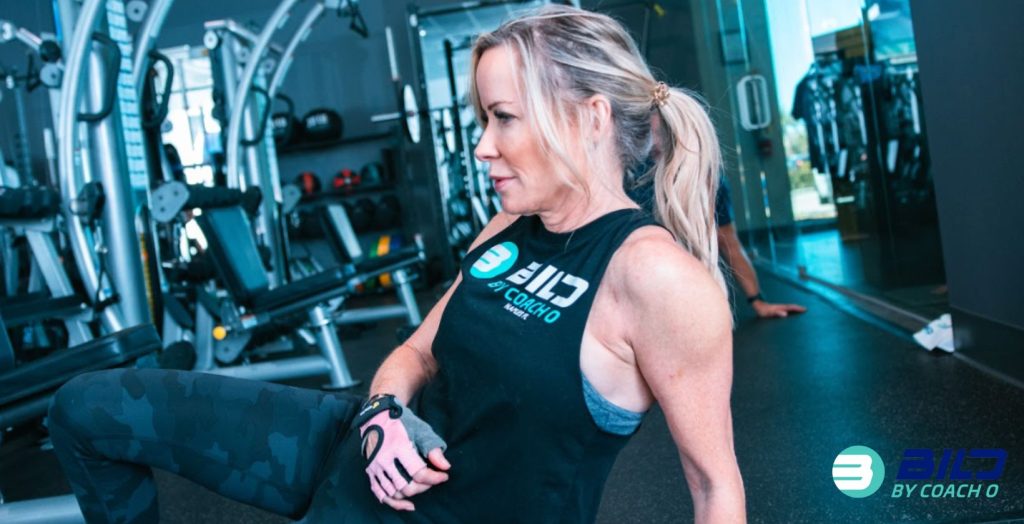 Woman performing functional training for weight loss at BILD by Coach O in Naples, FL
