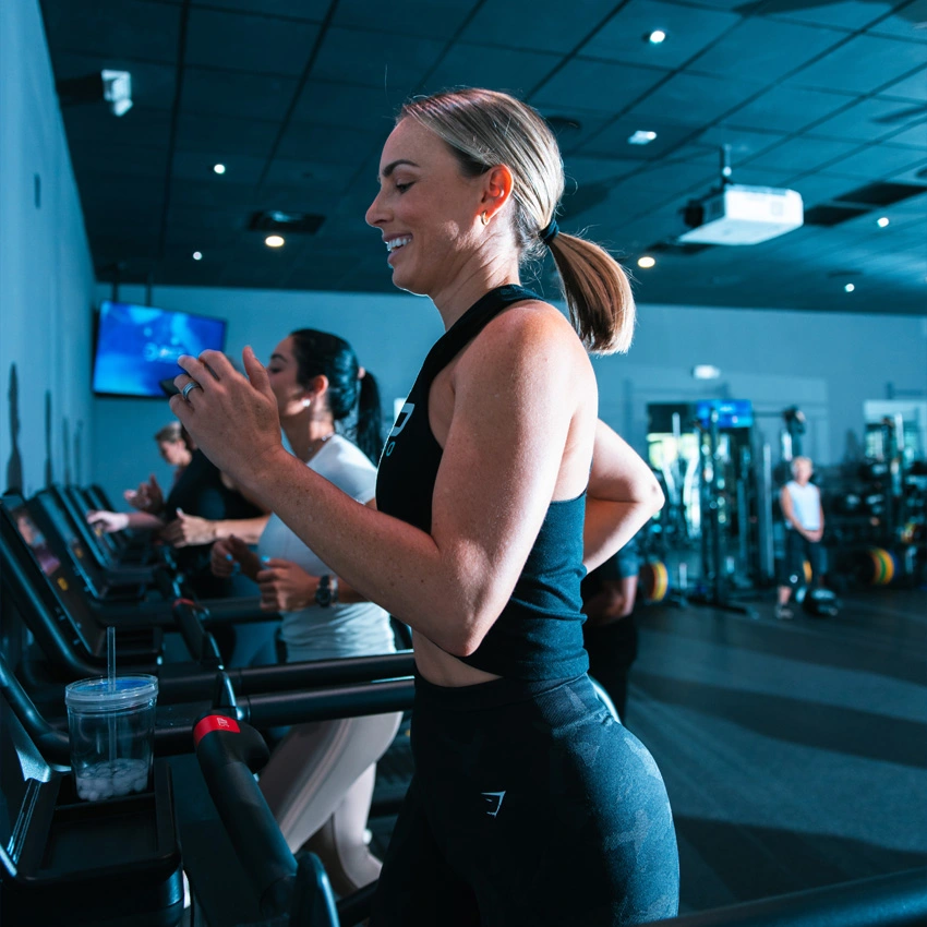 Women running on treadmills during a functional training class at BILD by Coach O