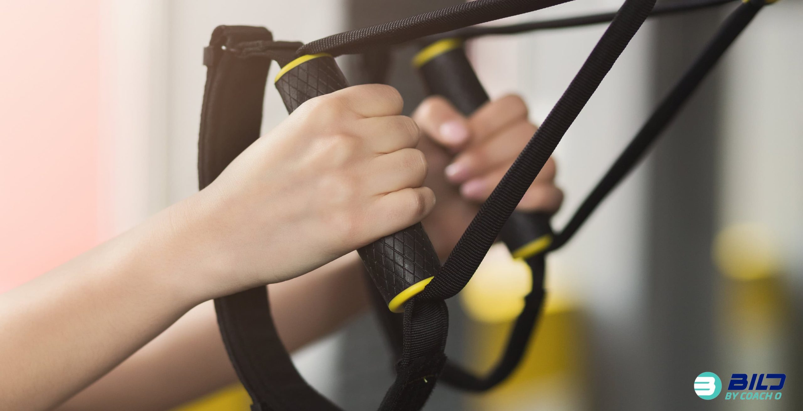 Close-up of woman’s hands lifting weights, showing benefits of strength training