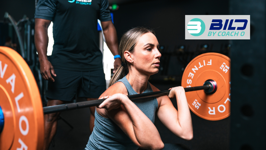 Girl lifting a barbell during a strength and conditioning class in Naples FL with Coach O coaching